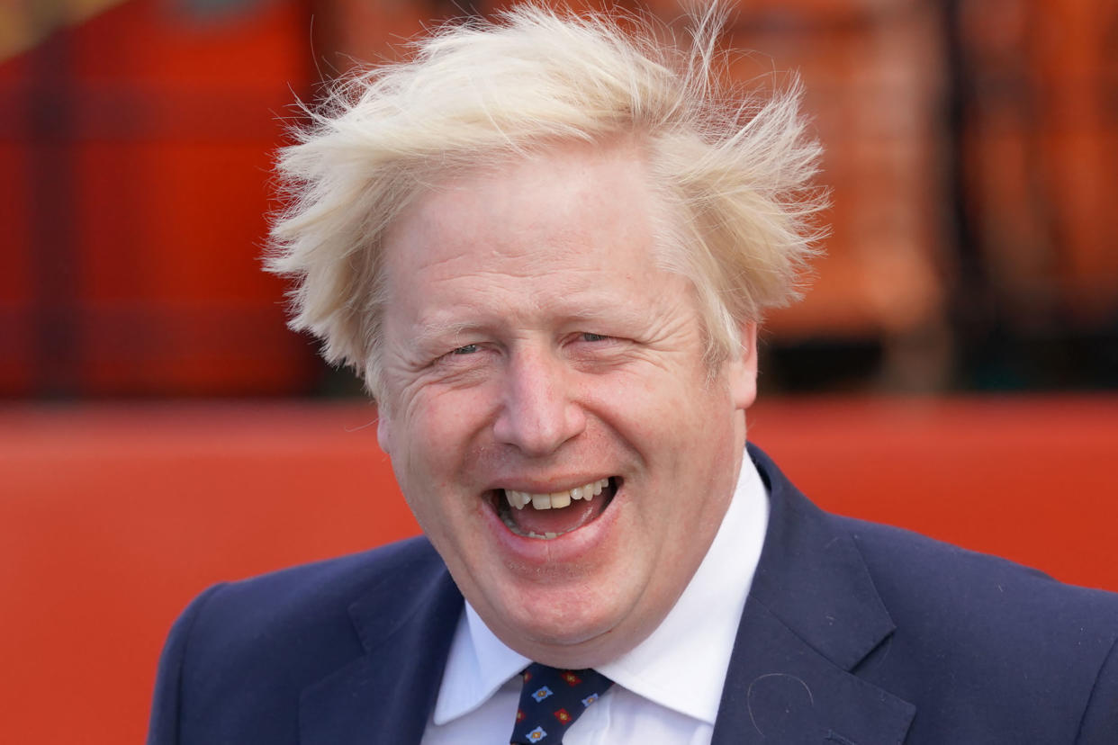 Britain's Prime Minister Boris Johnson gestures before boarding the vessel Alba at Fraserburgh Harbour, Aberdeenshire on August 5, 2021, on his way to the Moray Offshore Windfarm East on the second day of his two-day visit to Scotland. (Photo by Jane Barlow / POOL / AFP) (Photo by JANE BARLOW/POOL/AFP via Getty Images)