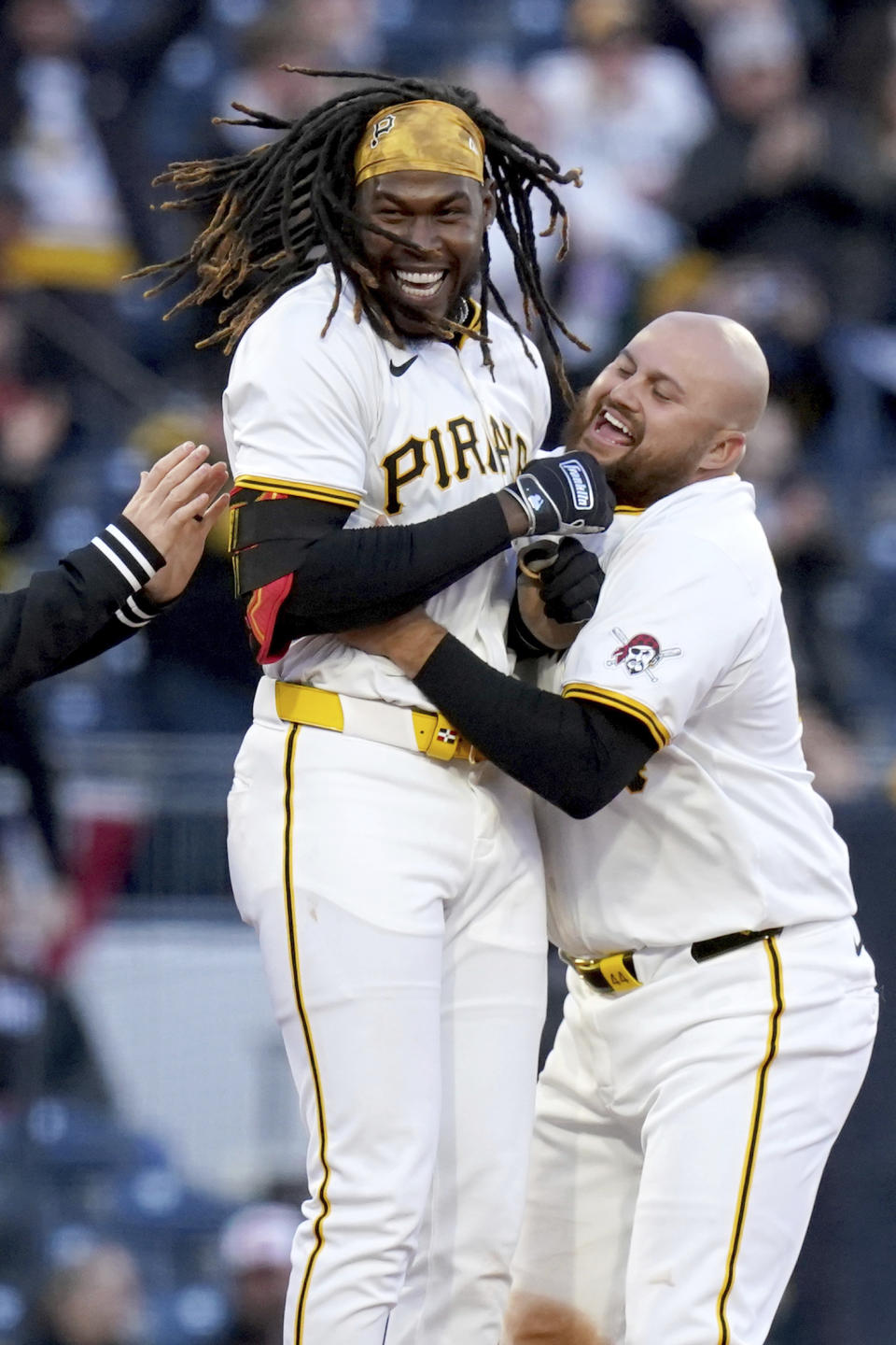 Pittsburgh Pirates' Oneil Cruz, left, celebrates with Rowdy Tellez, right, after hitting a walkoff single during the 11th inning of a baseball game against the Baltimore Orioles, Saturday, April 6, 2024, in Pittsburgh. (AP Photo/Matt Freed)
