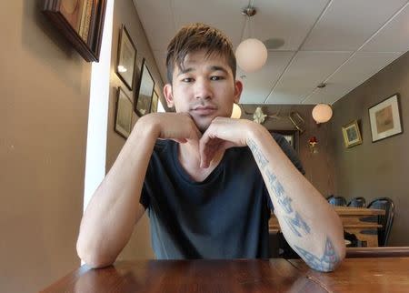 Amir Hassanzade poses for a photograph at a cafe in Karlshamn, Sweden, August 25, 2016. REUTERS/Alistair Scrutton