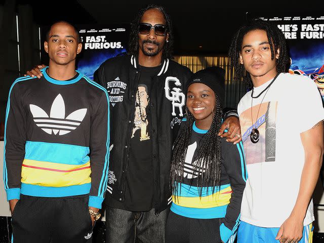 <p>Jason LaVeris/FilmMagic</p> Snoop Dogg, Cordell Broadus, Cori Broadus and Corde Broadus attend a screening of "Turbo" on July 16, 2013 in Hollywood, California.