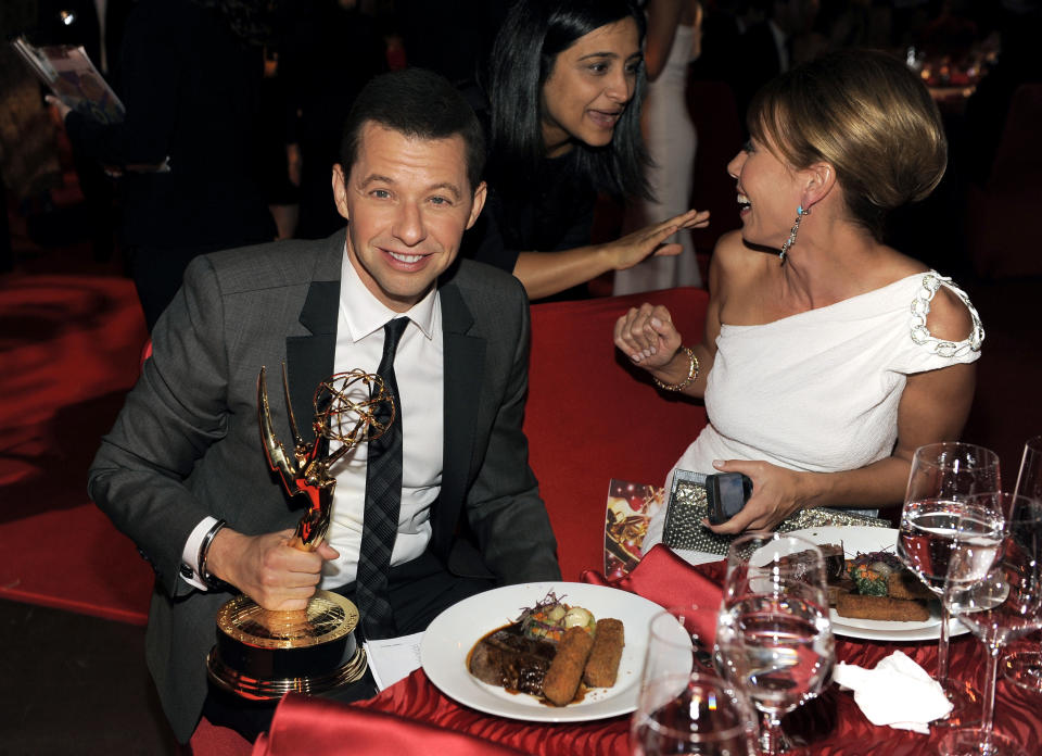 Jon Cryer, with his award for outstanding leading actor in a comedy series for "Two and a Half Men", left, and wife LIsa Joyner are seen at the 64th Primetime Emmy Awards Governors Ball on Sunday, Sept. 23, 2012, in Los Angeles. (Photo by Chris Pizzello/Invision/AP)