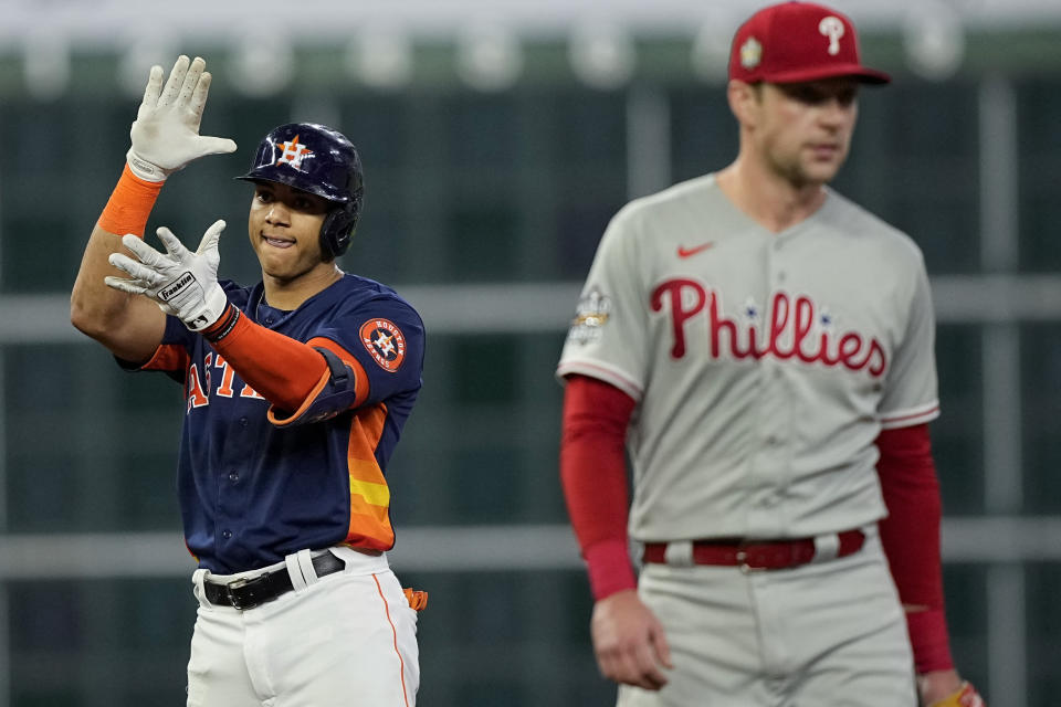 Houston Astros' Jeremy Pena celebrates his RBI-double during the first inning in Game 2 of baseball's World Series between the Houston Astros and the Philadelphia Phillies on Saturday, Oct. 29, 2022, in Houston. (AP Photo/David J. Phillip)