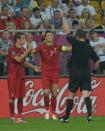 The French referee Stephane Lannoy (R) gives a yellow card to Portuguese defender Fabio Coentrao during the Euro 2012 championships football match Germany vs Portugal on June 9, 2012 at the Arena Lviv. AFP PHOTO / PATRIK STOLLARZPATRIK STOLLARZ/AFP/GettyImages