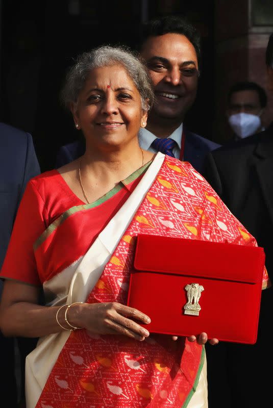 FILE PHOTO: India's Finance Minister Nirmala Sitharaman holds up a folder with the Government of India logo, as she leaves her office to present the federal budget in the parliament in New Delhi