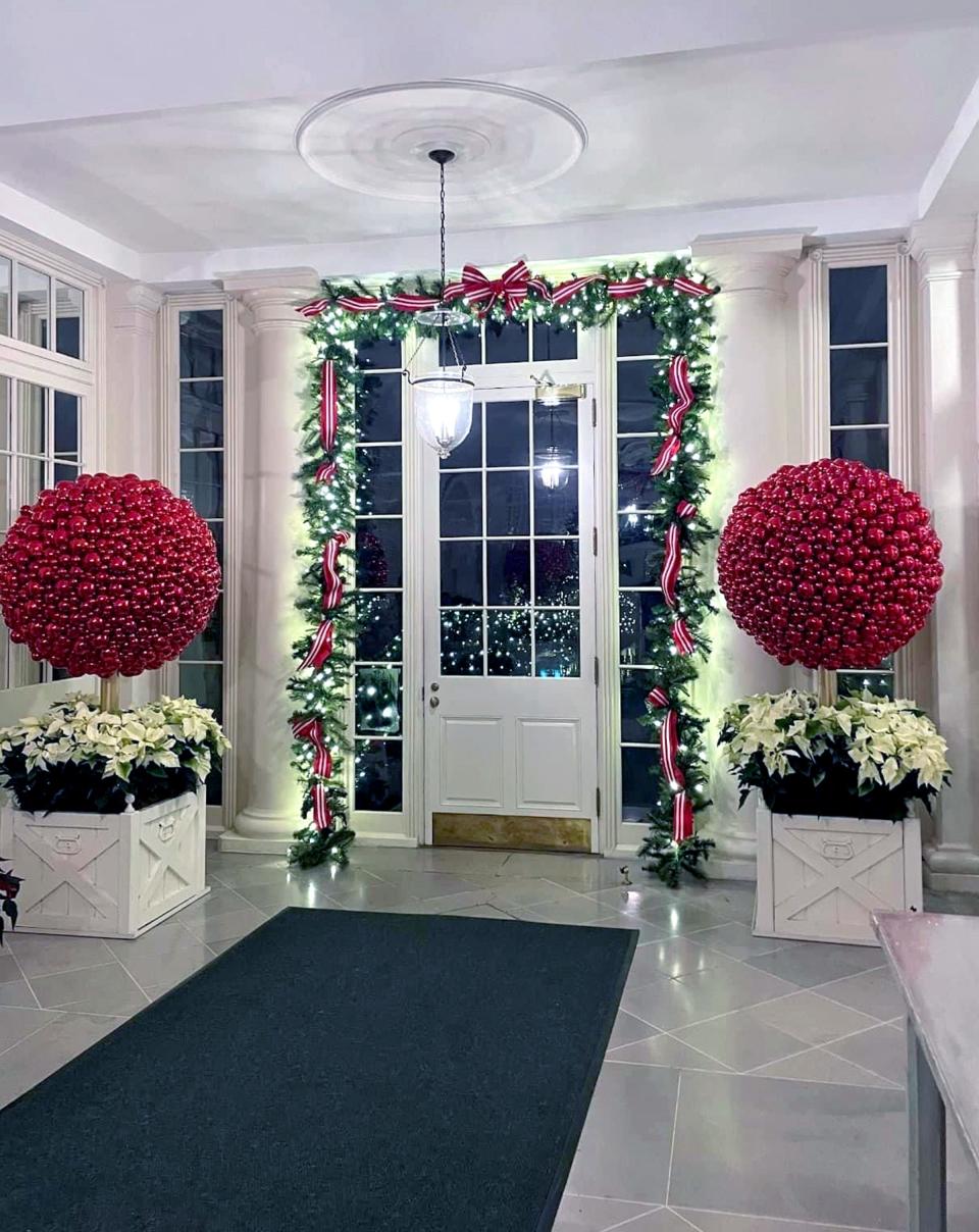 Mindy Shubert Geist of Edmond and other volunteers decorated an area of the White House with large red topiaries.