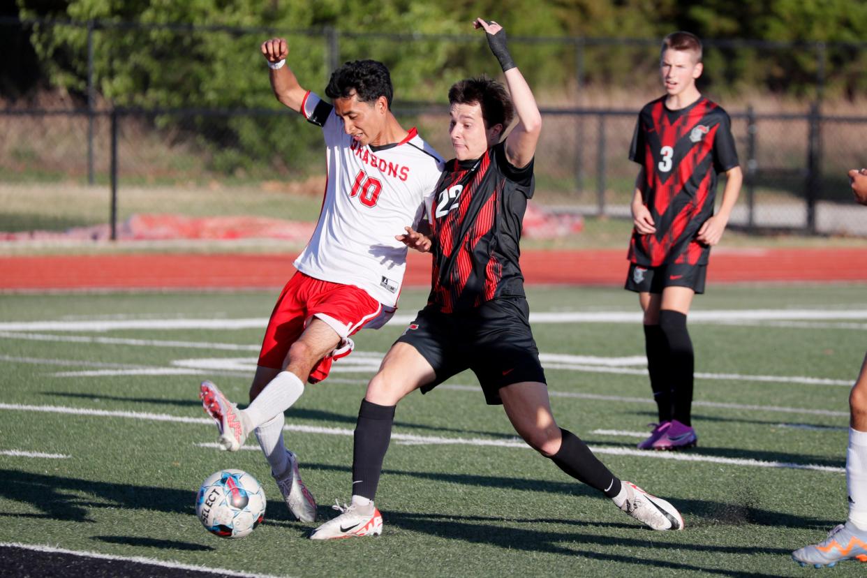 Crossings Christian's Christopher Billy, right, and Purcell's Ethan Velasco go for the ball during a boys soccer game against Crossings Christian in Oklahoma City, Tuesday, April 16, 2024.