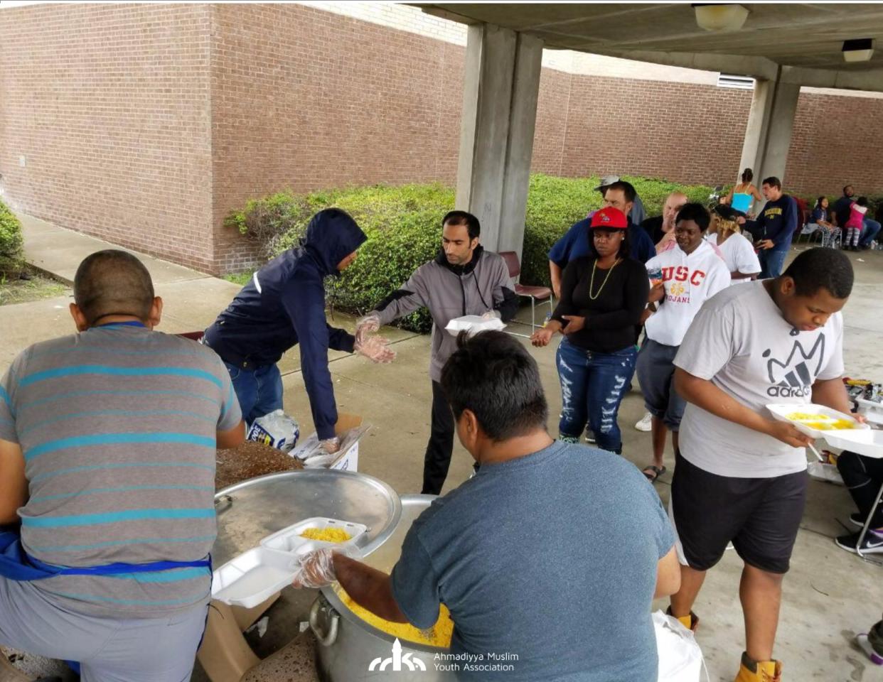 <span class="article-embeddable-caption">Members of the Ahmadiyya Muslim Youth Association hand out hot food in the Houston-area. </span><cite class="article-embeddable-attribution">Source: Ahmadiyya Muslim Youth Association USA</cite>