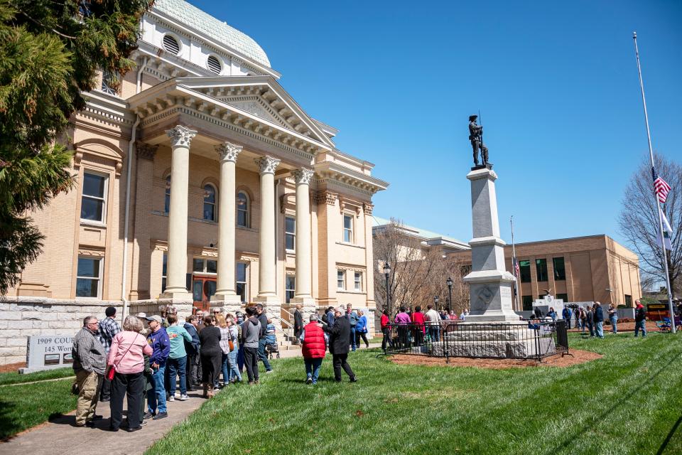 People gather at the historic 1909 courthouse in Asheboro, NC on March 27, 2022, for a prayer vigil put on by the Asheboro / Randolph County NAACP in response to the city's resistance to relocate a confederate monument which resides directly in front of the courthouse. (Photo by Luke Johnson)