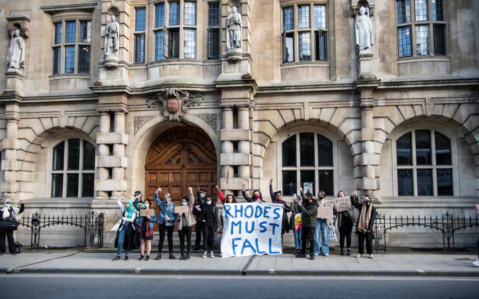 Demonstrators in Oxford call for the removal of the statue at a protest last month - Laurel Chor/Getty Images Europe