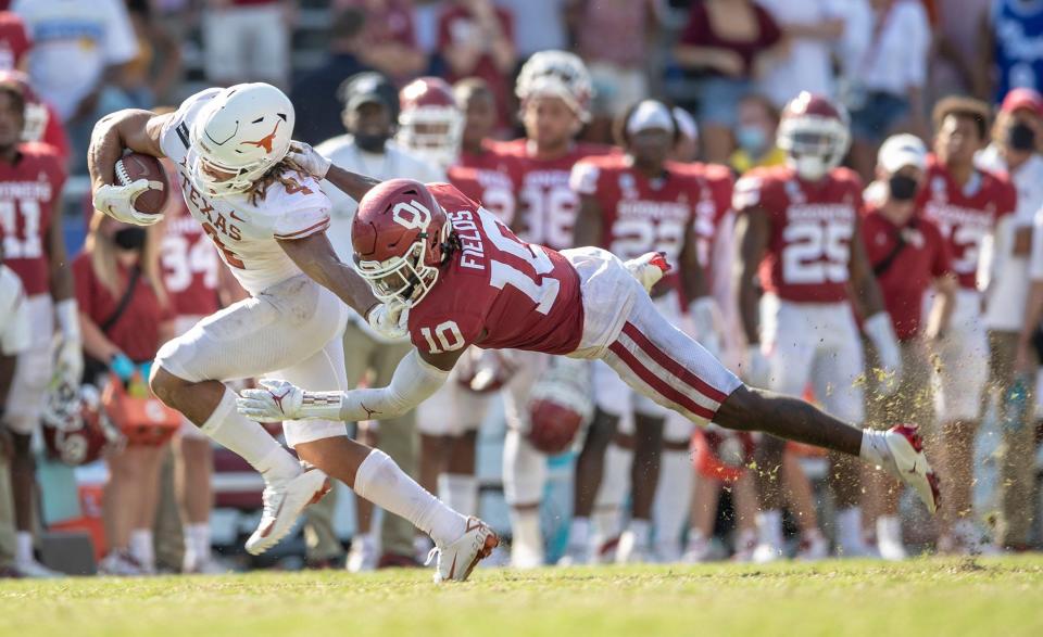 Who'll end up as Texas' leading receiver in the season opener against Louisiana-Monroe? Jordan Whittington, shown fighting for yardage after a catch in last year's Oklahoma game, figures to be one of Quinn Ewers' top targets.
