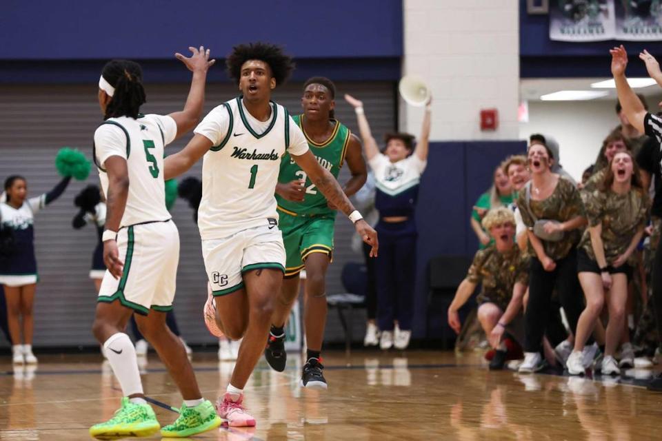 Great Crossing’s Vince Dawson (1) celebrated scoring a 3-pointer against Bryan Station during the 11th Region Tournament quarterfinals at Great Crossing High School on March 5.