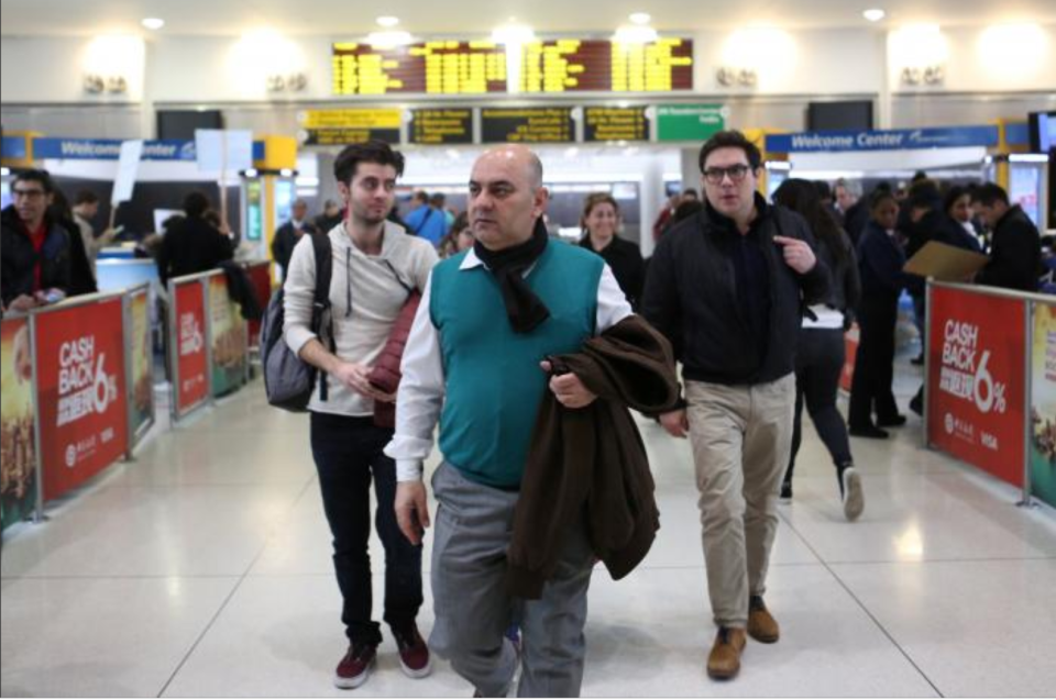 Fuad Sharef Suleman and his son Bnyad Fuad Sharef arrive at Terminal 1 at JFK airport in Queens, New York City, New York, U.S. February 5, 2017. The Iraqi family were previously prevented from boarding a plane to the U.S. following U.S. President Donald Trump's decision to temporarily bar travelers from seven countries, including Iraq.