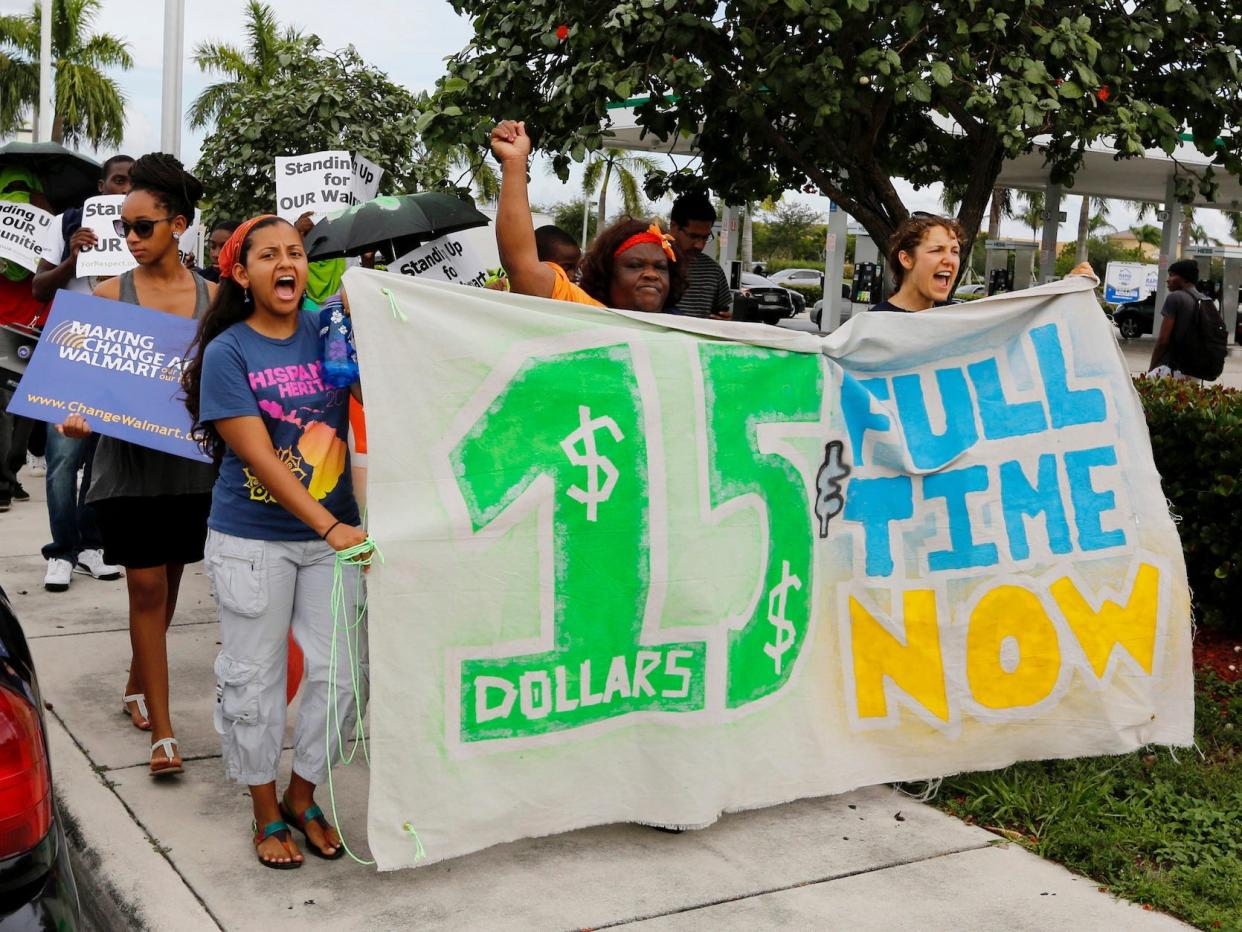 Walmart workers and supporters protest low wages outside one of the company's stores in Miami Gardens, Florida September 5, 2013