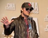 NASHVILLE, TN - NOVEMBER 01: Eric Church poses with his Album of the Year award for "Chief" at the 46th annual CMA Awards at the Bridgestone Arena on November 1, 2012 in Nashville, Tennessee. (Photo by Erika Goldring/Getty Images)
