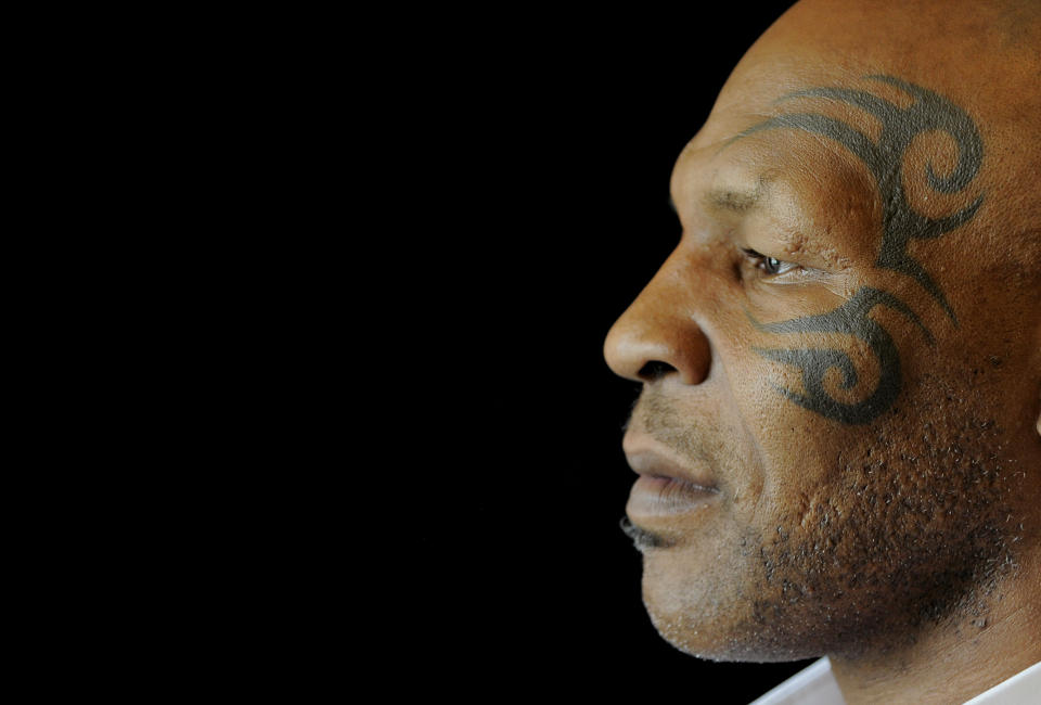 Mike Tyson, whose one-man stage show is chronicled by director Spike Lee in "Mike Tyson: Undisputed Truth," poses backstage during HBO's Summer 2013 TCA panel at the Beverly Hilton Hotel on Thursday, July 25, 2013, in Beverly Hills, Calif. The program was filmed on Broadway, where ``Mike Tyson: Undisputed Truth’’ ran last summer. (Photo by Chris Pizzello/Invision/AP)