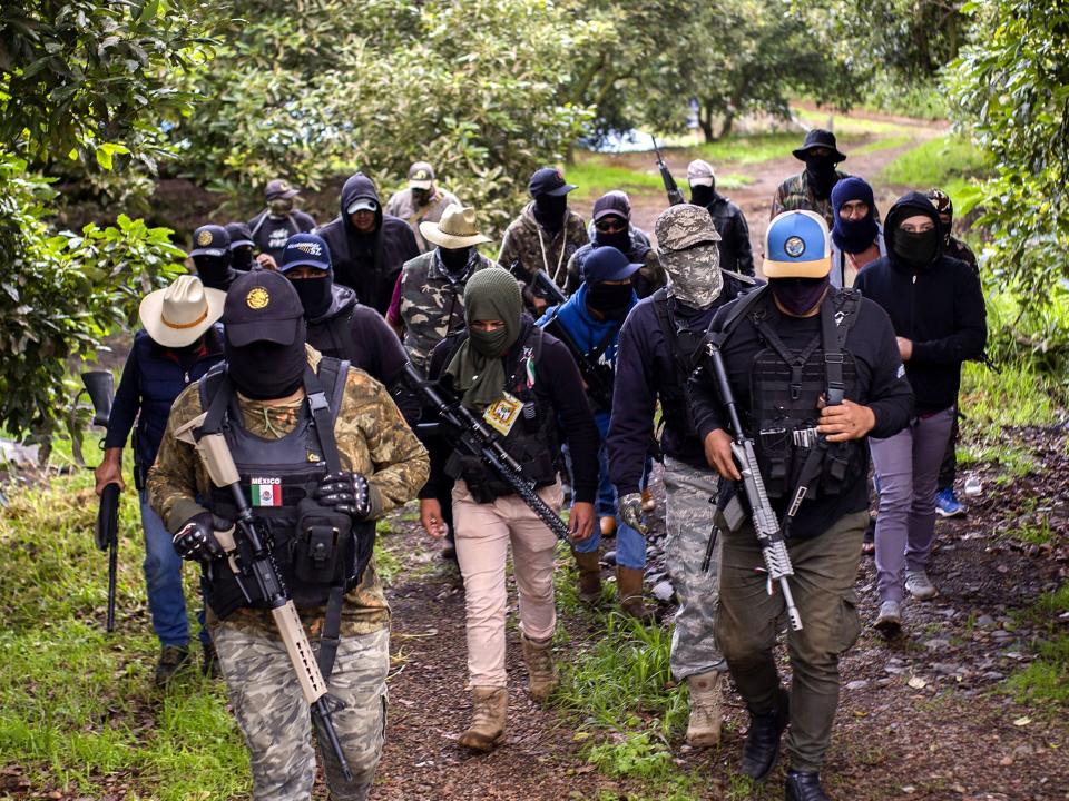 Members of the self-defense group Pueblos Unidos carry out guard duties in protection of avocado plantations, whipped by drug cartels that dominate the area, in Ario de Rosales, state of Michoacan, Mexico, on July 8, 2021.