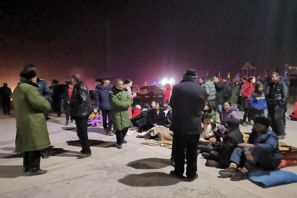 In this photo released by China's Xinhua News Agency, people gather in an open area after an earthquake in Jiashi County of Kashgar prefecture in northwestern China's Xinjiang Uighur Autonomous Region, Monday, Jan. 20, 2020. A strong earthquake has damaged buildings and injured at least one person seriously in China's far west Xinjiang region. (Li Chengxin/Xinhua via AP)