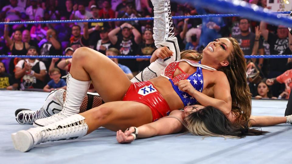 Mandy Rose (top) pins Blair Davenport in a match to unify the NXT and NXT UK women's titles.