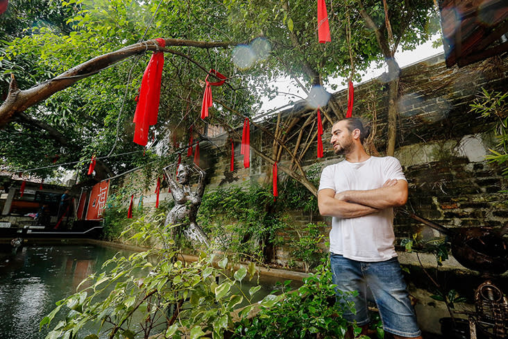 Aboud Fares posing with the stunning iron sculpture that greets visitors the minute they enter the courtyard — Pictures by Sayuti Zainudin