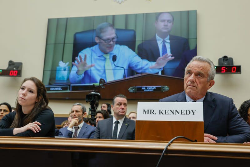 Emma-Jo Morris (L), a former New York Post reporter, and Robert F. Kennedy Jr. listen to opening statements from Chairman of the House Judiciary Committee Jim Jordan, R-Ohio, during a hearing Thursday. Photo by Jemal Countess/UPI