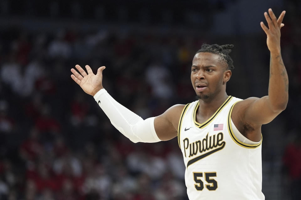 Purdue guard Lance Jones (55) reacts after missing a shot during the first half of an NCAA college basketball game against Wisconsin in the semifinal round of the Big Ten Conference tournament, Saturday, March 16, 2024, in Minneapolis. (AP Photo/Abbie Parr)