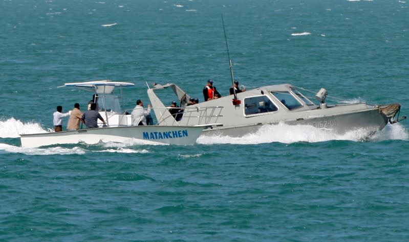 FILE PHOTO: Mexican patrol boat checks boat of a fisherman as they stand guard over California Gulf porpoises, also known as vaquitas, in San Felipe