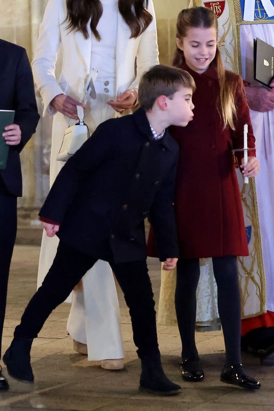 britains princess charlotte of wales r has her candle blown out by britains prince louis of wales l at the together at christmas carol service at westminster abbey in london on december 8, 2023 the event will be broadcast as part of royal carols together at christmas, a special programme, airing at 745pm on itv1 and itv x on christmas eve photo by chris jackson pool afp photo by chris jacksonpoolafp via getty images