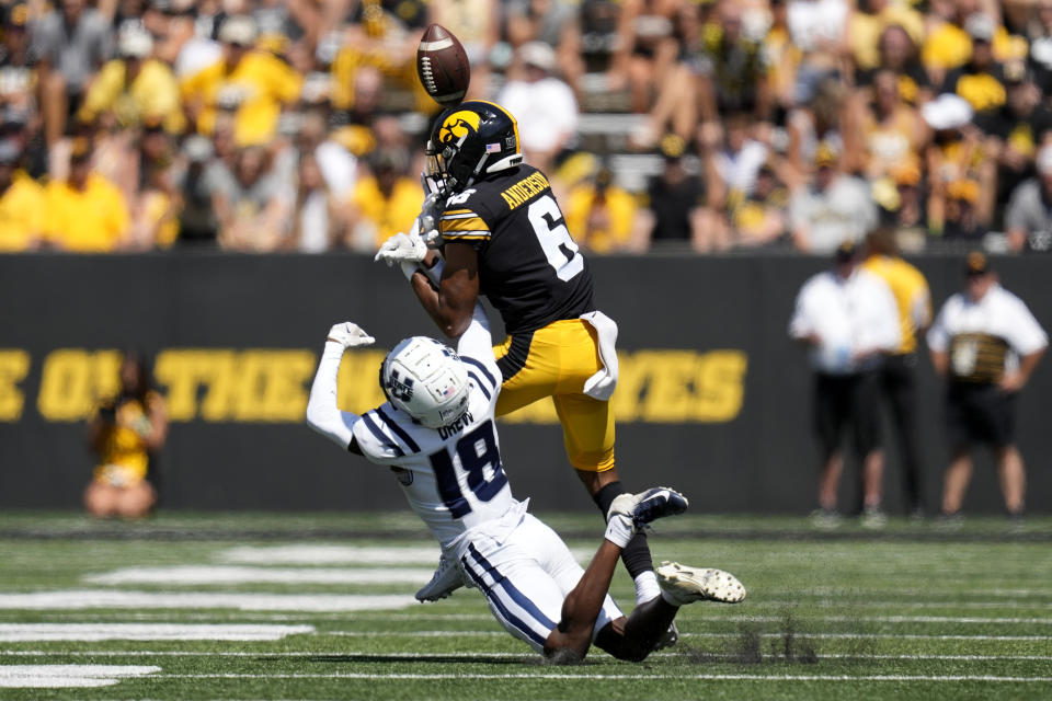 Utah State cornerback JD Drew (18) breaks up a pass intended for Iowa wide receiver Seth Anderson (6) during the first half of an NCAA college football game, Saturday, Sept. 2, 2023, in Iowa City, Iowa. (AP Photo/Charlie Neibergall)