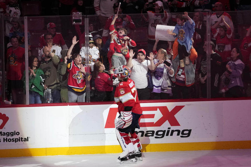 Florida Panthers goaltender Sergei Bobrovsky gives his stick to a fan after the team's NHL hockey game against the Buffalo Sabres, Saturday, April 13, 2024, in Sunrise, Fla. Bobrovsky played in his 700th NHL game. (AP Photo/Lynne Sladky)
