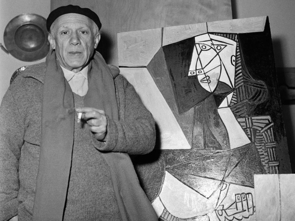 Pablo Picasso with one of his latest works in Vallauris, France.