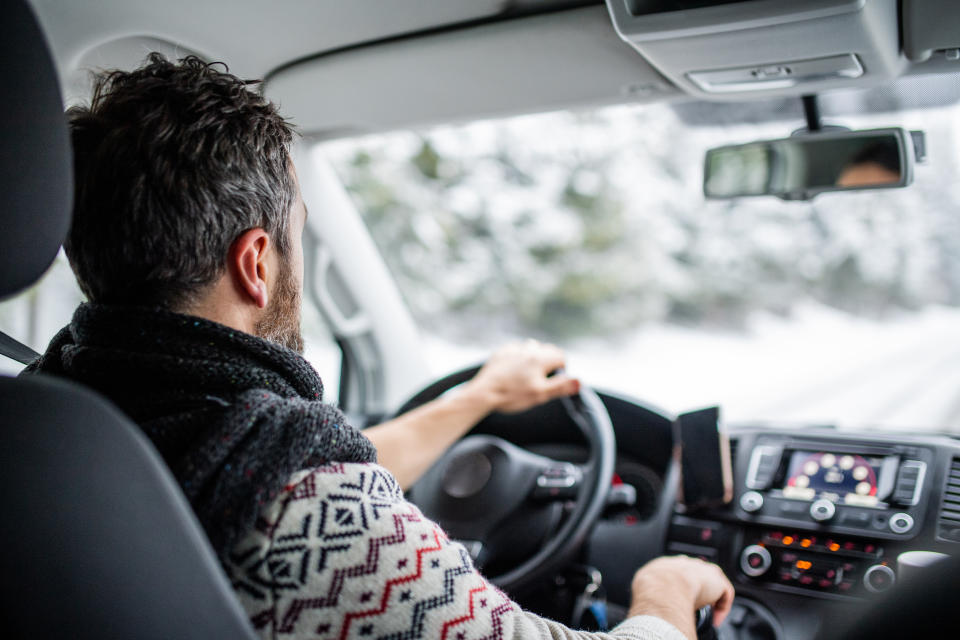 Man driver car traveling in winter.