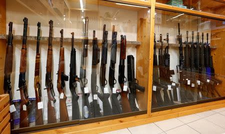 Different types of rifles are displayed at Wyss Waffen gun shop in the town of Burgdorf, Switzerland August 10, 2016. REUTERS/Arnd Wiegmann