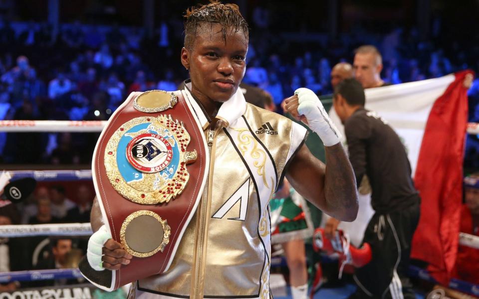 Nicola Adams poses with the belt after a split decision in her WBO World Flyweight Championship bout against Maria Salinas - PA