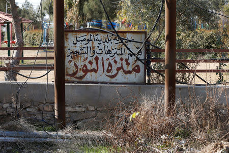 A sign reads "Nour Park" in Arabic at Mosul's zoo, Iraq, February 2, 2017. REUTERS/Muhammad Hamed