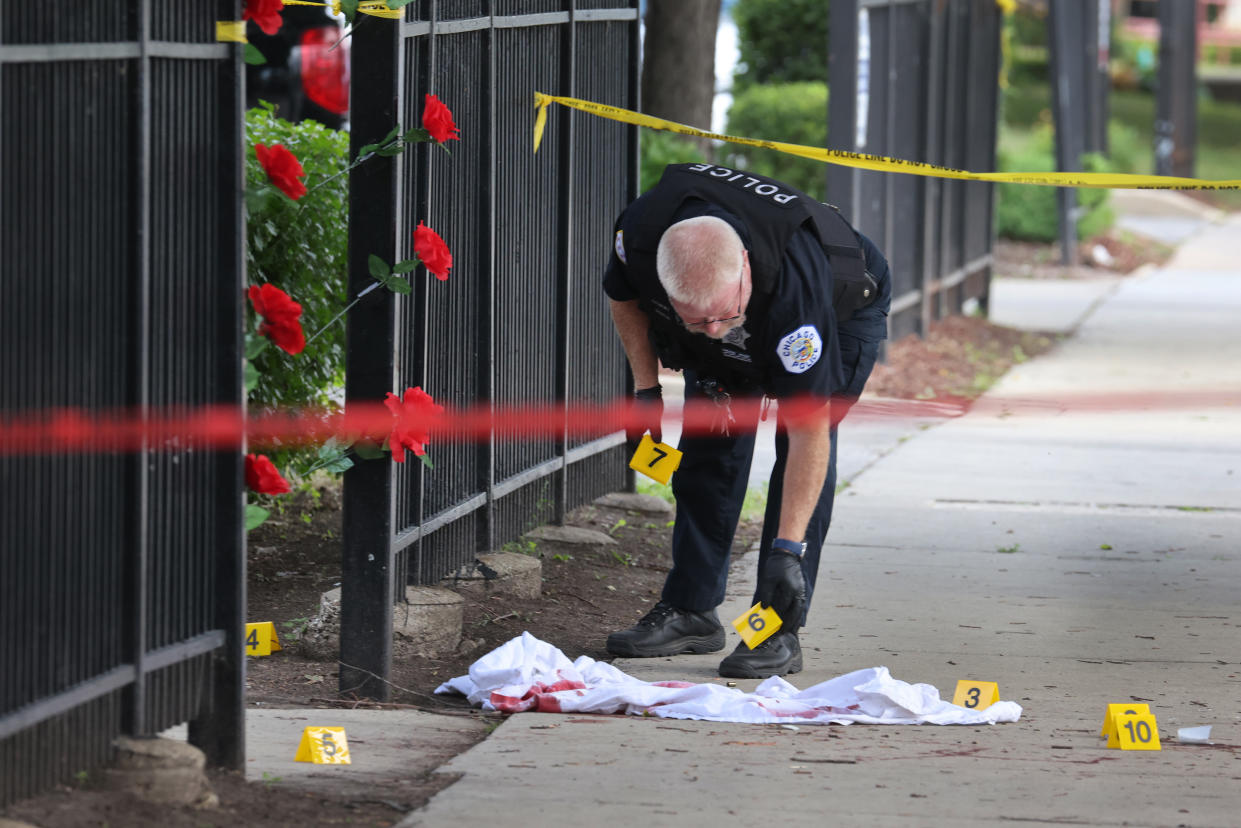 Police investigate a crime scene where three people were shot at the Wentworth Gardens housing complex in the Bridgeport neighborhood on June 23, 2021 in Chicago, Illinois. (Scott Olson/Getty Images)