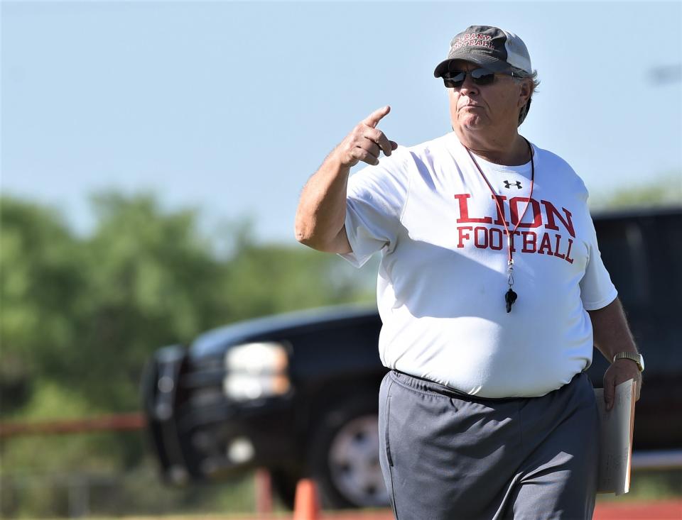 Albany coach Denney Faith directing his team in practice in August. The Lions entered the season No. 1 in the state, and finished the season No. 1 in the state after a 41-21 win over Mart.