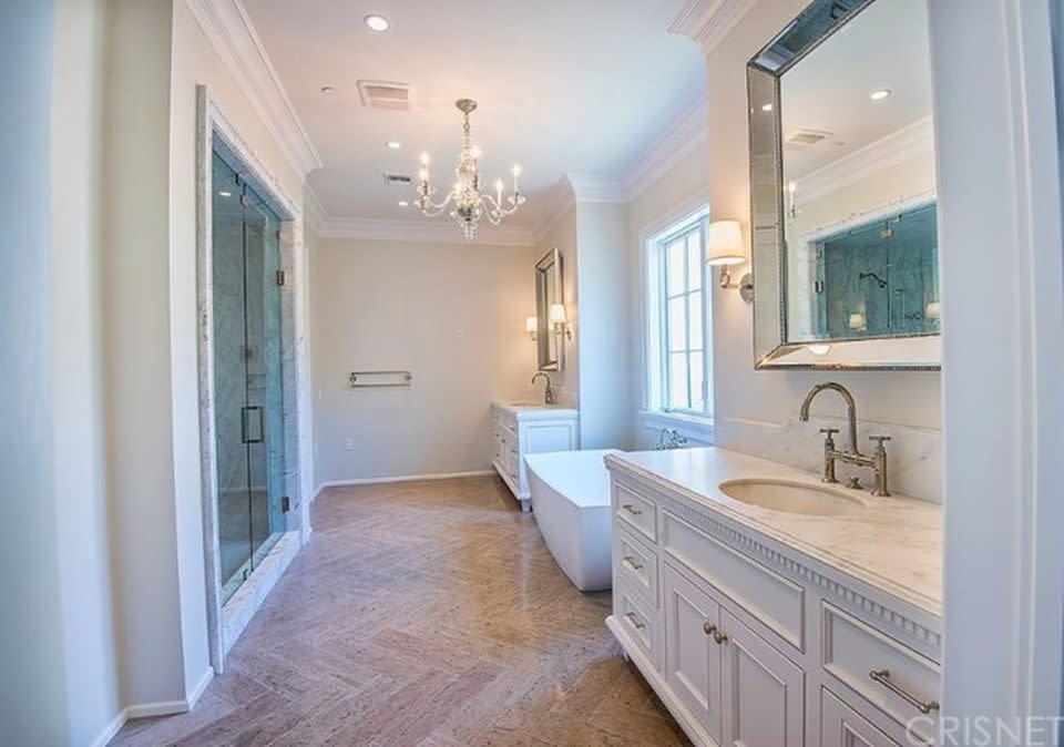 <p>The house has seven bathrooms all up, all featuring marble. Photo: zillow.com/Berkshire Hathaway HomeServices </p>
