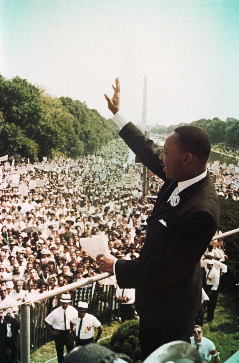 Dr. Martin Luther King Jr. waves to participants during the March on Washington, on August 28, 1963.