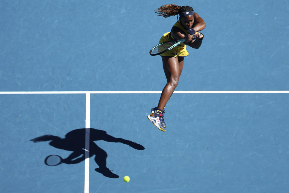 Coco Gauff of the U.S. plays a backhand return to Marta Kostyuk of Ukraine during their quarterfinal match at the Australian Open tennis championships at Melbourne Park, Melbourne, Australia, Tuesday, Jan. 23, 2024. (AP Photo/Asanka Brendon Ratnayake)