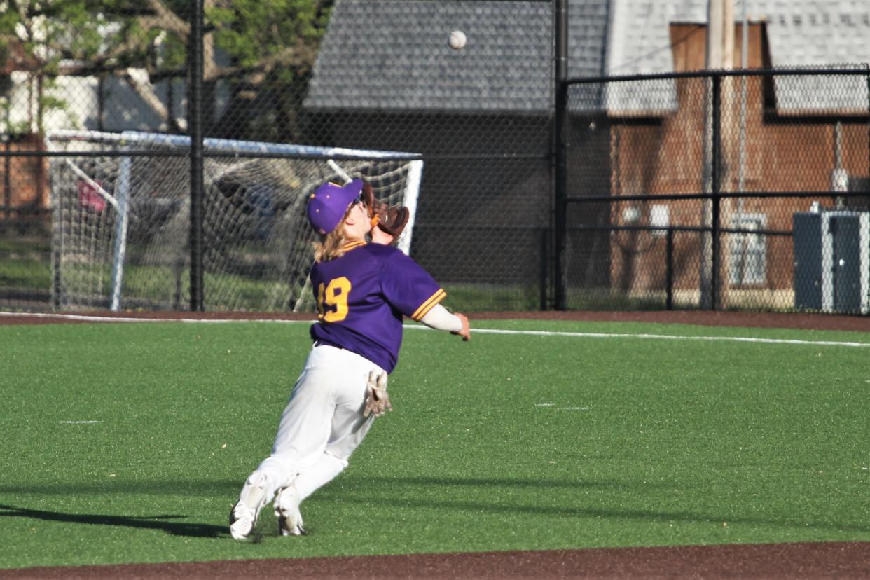 Hickman's Hank Cummings lays out for a catch during the Rock Bridge's 4-3 win over the Kewpies in eight innings on May 3, 2023, at Hickman High School.