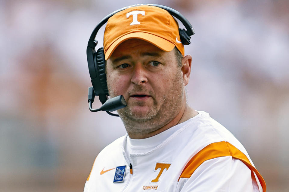 FILE - Tennessee coach Josh Heupel congratulates players after a touchdown during the second half of the team's NCAA college football game against Florida on Saturday, Sept. 24, 2022, in Knoxville, Tenn. Tennessee won 38-33. Heupel was named Coach of the year for the AP All-SEC team announced Monday, Dec. 5, 2022. (AP Photo/Wade Payne, File)