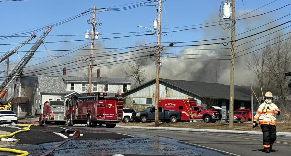 The property at 29 River Street in Sanford, Maine, is engulfed in smoke as firefighters battled a blaze and high winds there on Thursday, March 21, 2024.