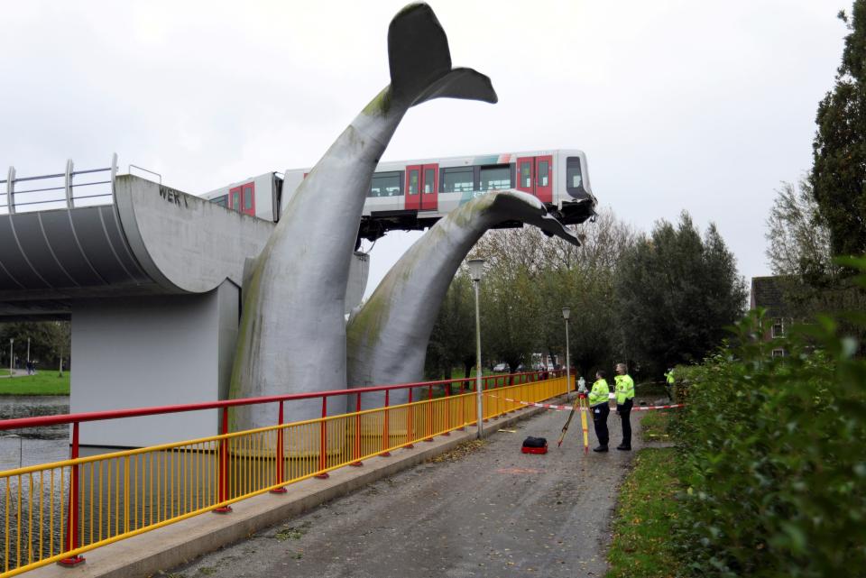 A general view of a metro that crashed through a stop block and landed on an artwork of a whale tail at De Akkers subway station in Spijkenisse, near Roterdam, Netherlands November 2, 2020. REUTERS/Eva Plevier