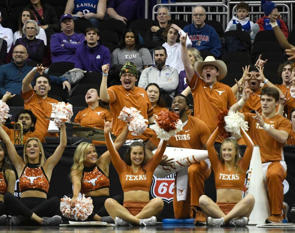 Texas' band and cheerleaders celebrate a Longhorns basket during Thursday's Big 12 Tournament quarterfinals loss to TCU. The early exit may hurt Texas' seeding for next week's NCAA Tournament.