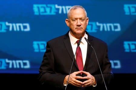 FILE PHOTO: Blue and White party leader Benny Gantz reacts at the party's headquarters following the announcement of exit polls during Israel's parliamentary election in Tel Aviv