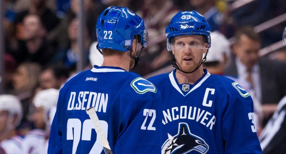 Henrik Sedin added another impressive milestone to his resume Friday when he notched his 1,000 career point - a goal assisted by brother Daniel. (Photo by Rich Lam/Getty Images)