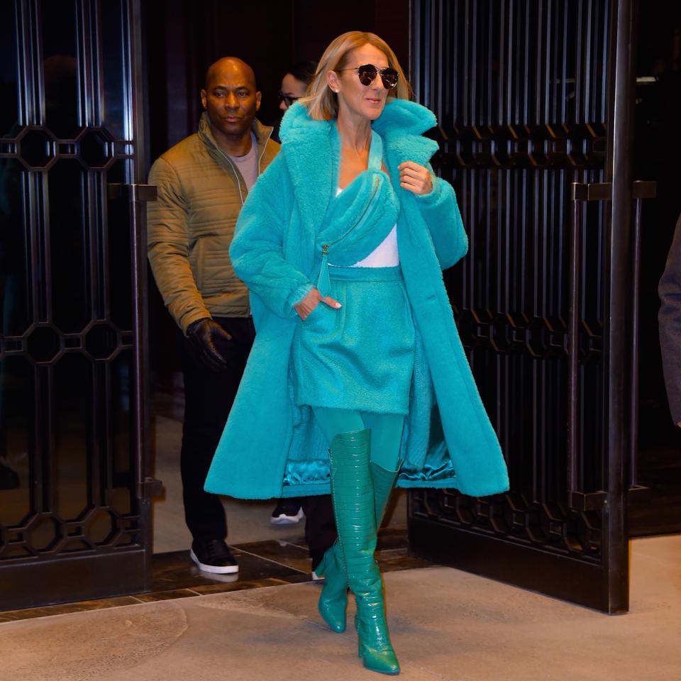 Celine Dion turned heads in the aqua blue longline teddy coat. [Photo: Getty]