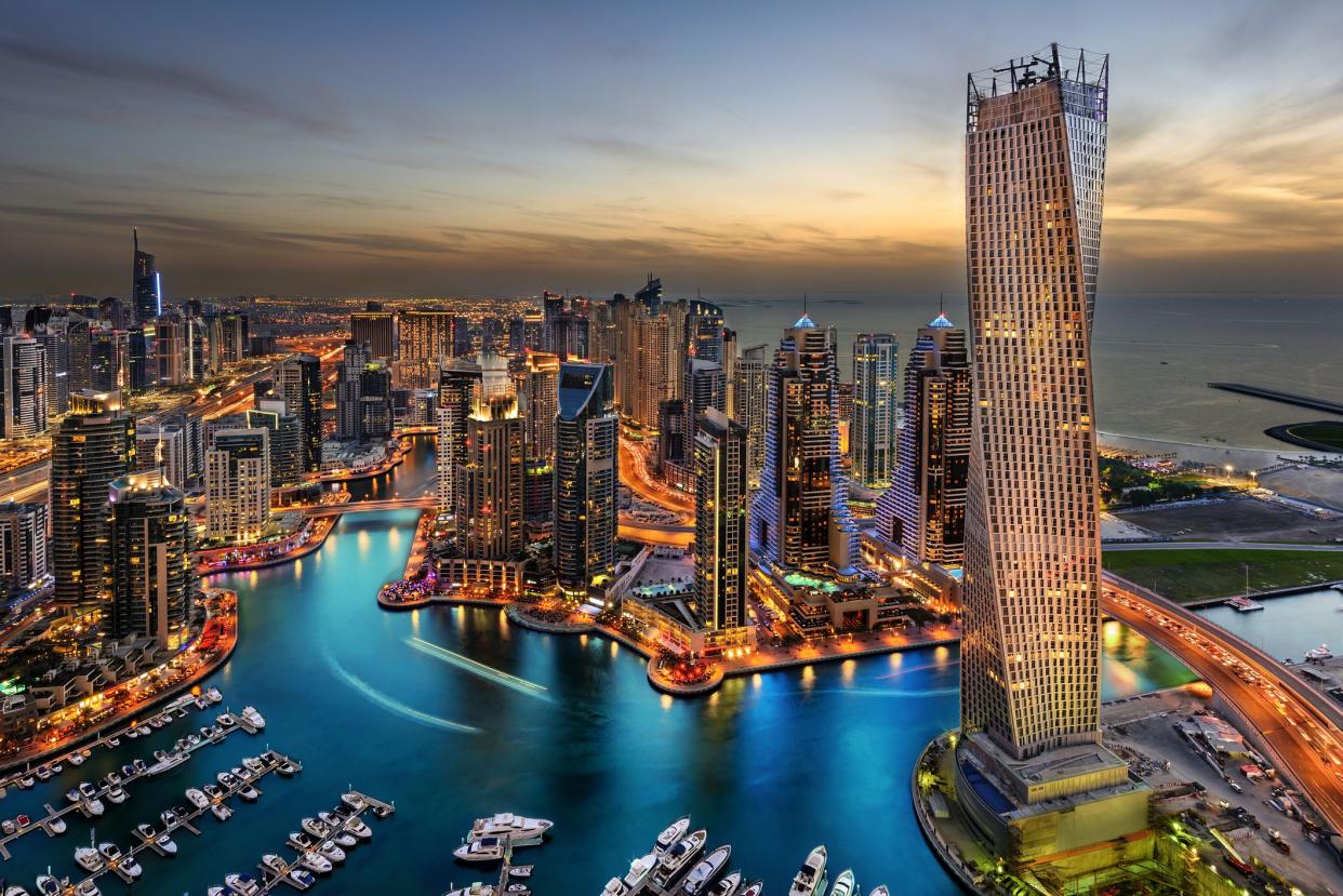 Dubai Marina from a high view showing the boats, sea, and the city scape.