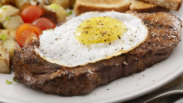 steak with fried egg on top