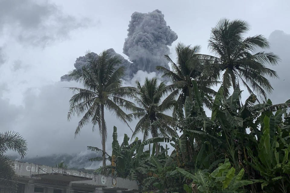 Ash and steam are spewed from Mount Bulusan, as seen from Casiguran, Sorsogon province, Philippines on Sunday June 5, 2022. The volcano southeast of the Philippine capital spewed ash and steam about a kilometer into the sky in a brief steam-driven explosion on Sunday, scattering ash in nearby villages and alarming residents, officials said. (AP Photo/Karlyn Dupan Hamor)